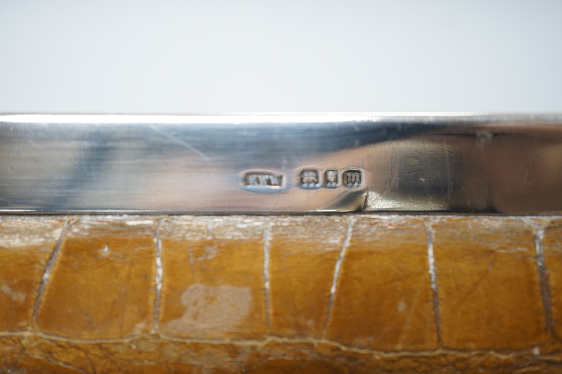 An Edwardian lady’s silver mounted crocodile clutch bag